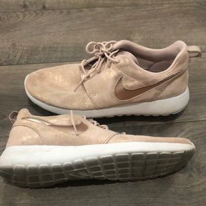 Rose gold metallic Nike shoes